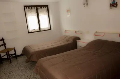 Cama o camas de una habitación en Casa Blascosanz - piso para 6 personas en el pirineo