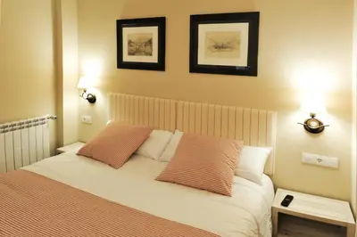 Cama o camas de una habitación en Chardín de Llis-Apartamentos Chardins