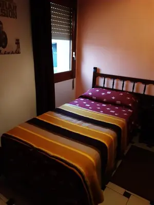 Cama o camas de una habitación en Hostal El Molino