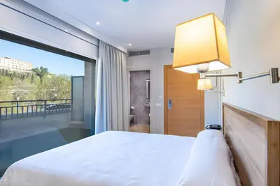 Cama o camas de una habitación en HOTEL JAUME D'URGELL