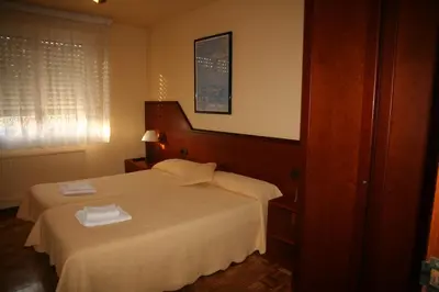 Cama o camas de una habitación en Pensión Acella
