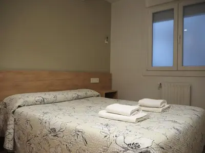 Cama o camas de una habitación en Pensión Acella