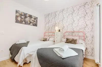 Cama o camas de una habitación en ROSANA BY CARDI SUITES