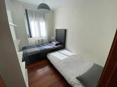Cama o camas de una habitación en Apartamento tranquilo Vielha Centro con Parking Gratuito