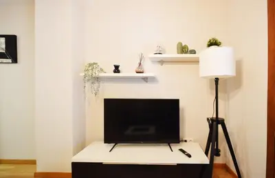 Una televisión o centro de entretenimiento en Apartamento Encanto Tarazona Plaza de España
