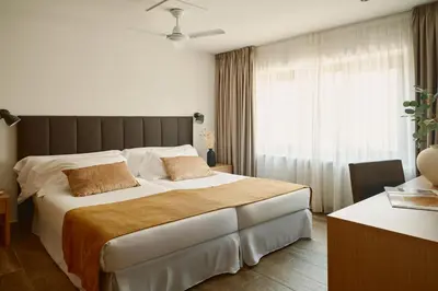 Cama o camas de una habitación en Hotel MET Pamplona