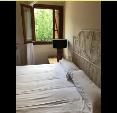 Cama o camas de una habitación en Apartamento un dormitorio Los Altos de Escarrilla, FORMIGAL-PANTICOSA