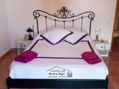 Cama o camas de una habitación en Casa Rural Mas de les Àligues