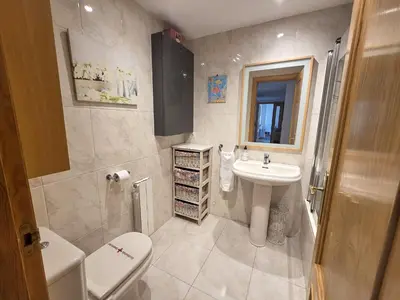 Un baño de Apartamentos Pilartxo Jaca 3000