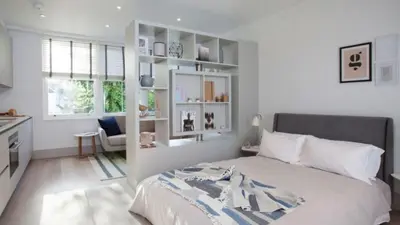 Cama o camas de una habitación en The Roundabout Hideout Room 1