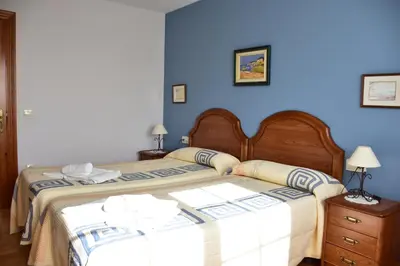 Cama o camas de una habitación en Casa Raichu - Pilgrim Guesthouse