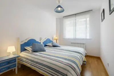 Cama o camas de una habitación en Apartamentos IRENE en el Pirineo Aragonés
