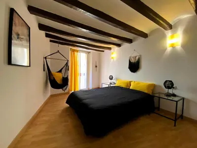 Cama o camas de una habitación en Cornu Karma Apartment El Pati