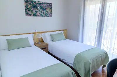 Cama o camas de una habitación en Ca l'Apotecari