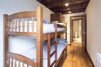 Cama o camas de una habitación en Luderna - Apartamento Val de Ruda A10 Gerber