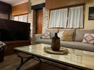 Una televisión o centro de entretenimiento en Apartamento Selva Blanca 9