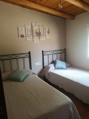 Cama o camas de una habitación en Mas del Olivar