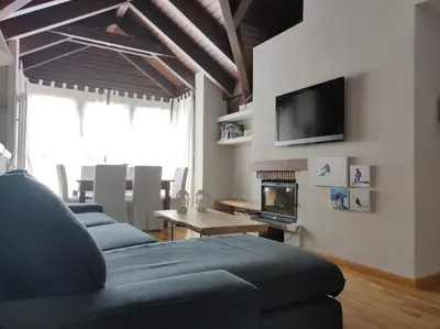 Una televisión o centro de entretenimiento en Casa Marmotte - tucasaenlospirineos