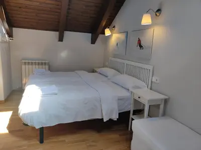 Cama o camas de una habitación en Casa Marmotte - tucasaenlospirineos