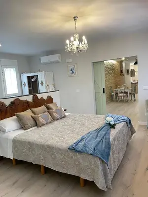 Cama o camas de una habitación en Apartamentos LA SOMERA
