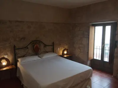 Cama o camas de una habitación en El Manzano