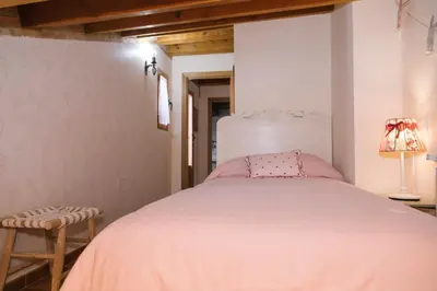Cama o camas de una habitación en Casa rural el gato encantado