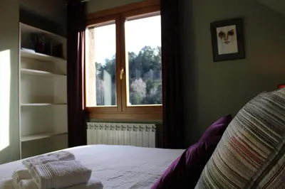 Cama o camas de una habitación en El Balcón del Garmo