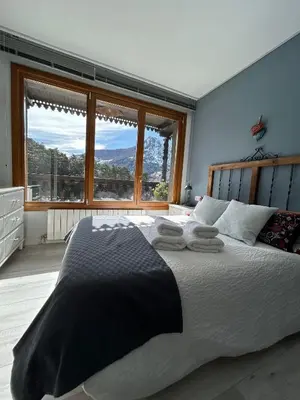 Cama o camas de una habitación en El Balcón del Garmo