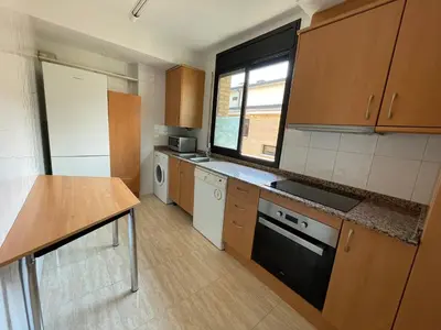 Una cocina o zona de cocina en Duplex tres habitaciones Pirineo