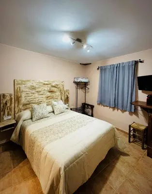 Cama o camas de una habitación en El Rincón de Andrea Habitaciones