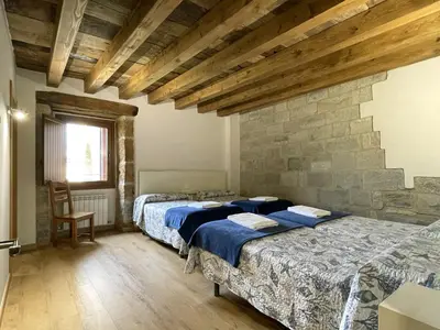 Cama o camas de una habitación en Palacio de Aralar Grande Familias