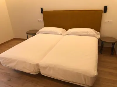 Cama o camas de una habitación en HOTEL MONTE PERDIDO
