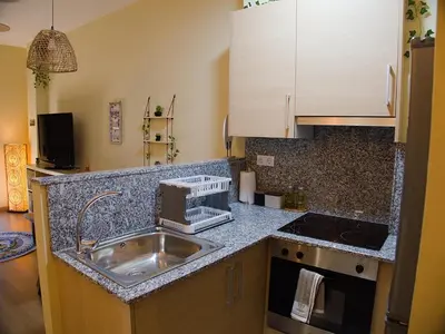 Una cocina o zona de cocina en Grace, apartamento con terraza y vistas