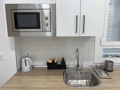 Una cocina o zona de cocina en Apartamenticos Boggiero VI