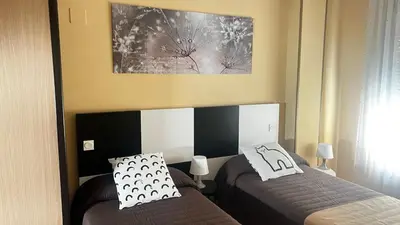 Cama o camas de una habitación en El Primero G Zaragoza - Aljafería