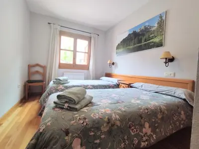 Cama o camas de una habitación en CHECK-IN CASAS Siñoantonio
