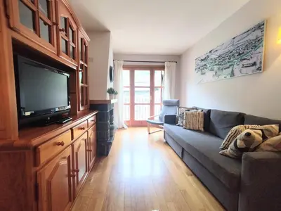 Una televisión o centro de entretenimiento en CHECK-IN CASAS Siñoantonio