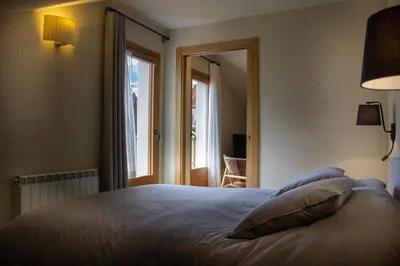 Cama o camas de una habitación en Apartaments Areny - L'Amfitriona
