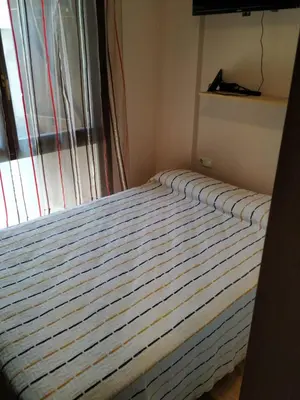 Cama o camas de una habitación en Apartamento en Escarrilla, sallent de gallego