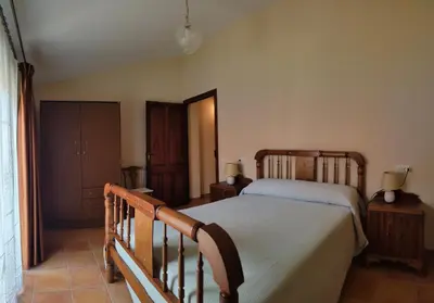 Cama o camas de una habitación en Casa Rural María
