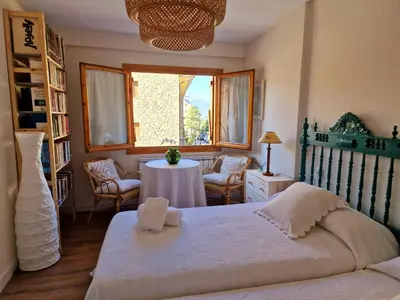 Cama o camas de una habitación en ESQUÍ PIRINEO ARAGONÉS APARTAMENTO EL JUNCARAL Wifi