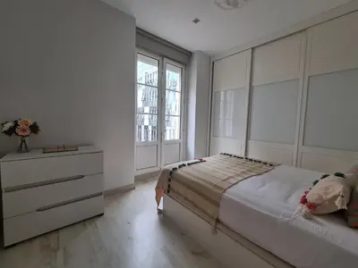 Cama o camas de una habitación en Dos Torres Arte en Balcones - Calle Alfonso I