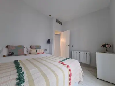 Cama o camas de una habitación en Dos Torres Arte en Balcones - Calle Alfonso I