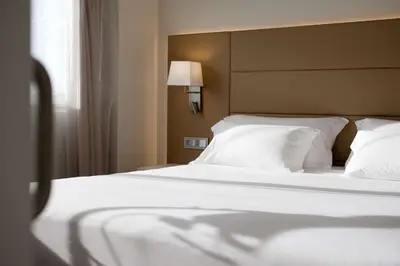 Cama o camas de una habitación en NH Pamplona Iruña Park