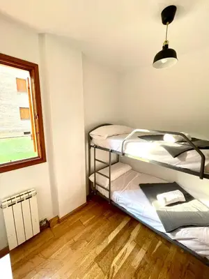 Cama o camas de una habitación en ACOGEDOR PISO EN SORT CON PISCINA