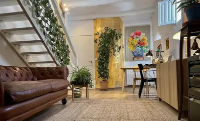 Una televisión o centro de entretenimiento en Apartamento Romanov