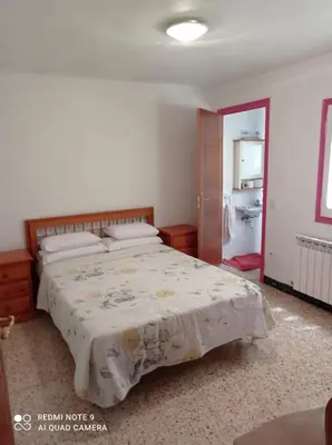 Cama o camas de una habitación en Apartamento Benabarre Huesca