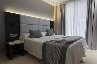 Cama o camas de una habitación en Habitus Hotel Europa