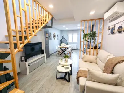Una televisión o centro de entretenimiento en Apartamentos Buganvilla