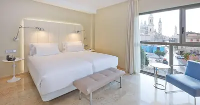 Cama o camas de una habitación en NH Ciudad de Zaragoza